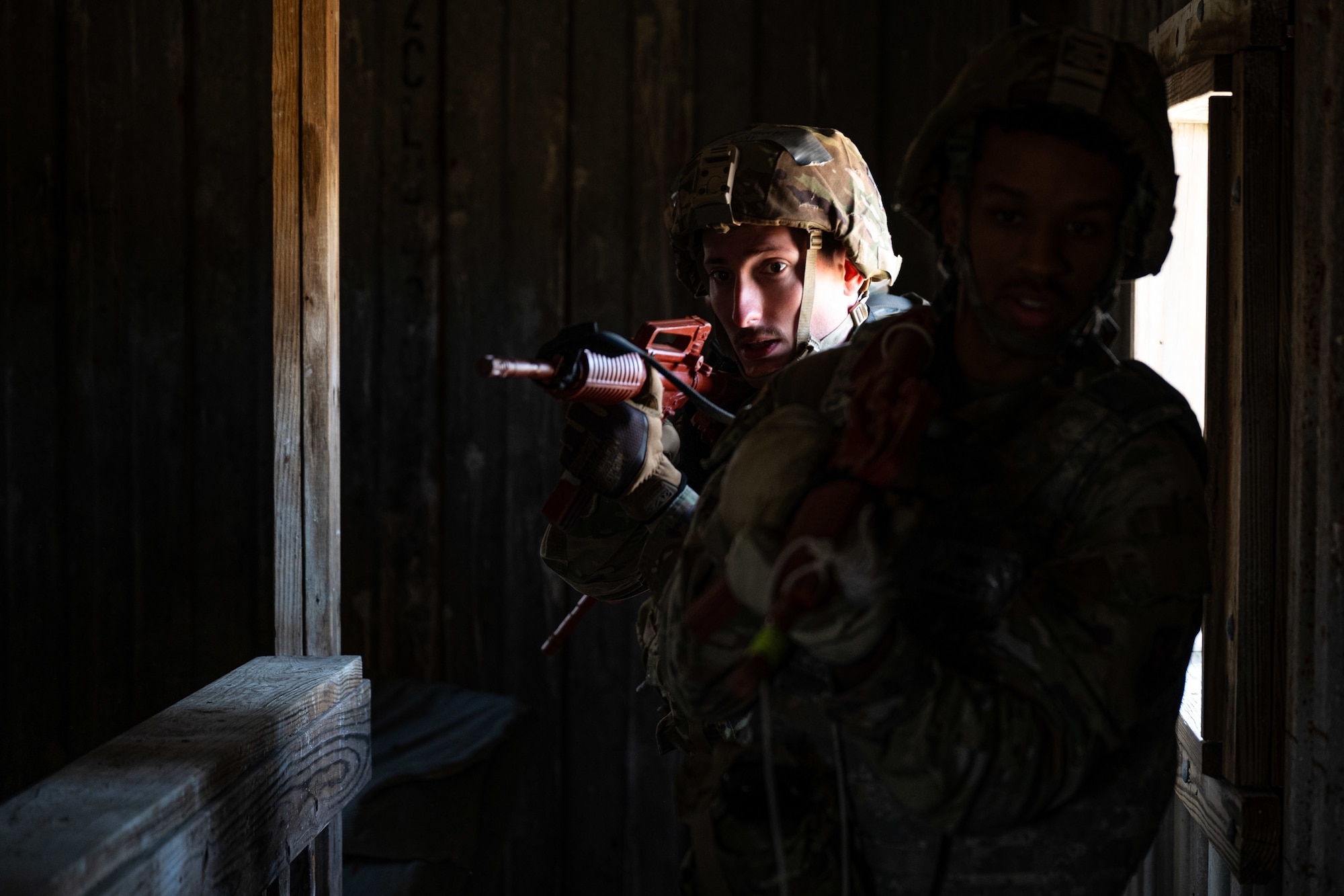 Staff Sgt. David Yosick, 509th operations group independent duty medical technician, goes through a shoot house during a field training exercise in Macon, Mo., March 12, 2025. The exercise tested warfighter readiness by simulating austere environments and complex enemy engagements, pushing participants to adapt and overcome challenges. (U.S. Air Force photo by Senior Airman Bryson Sherard)