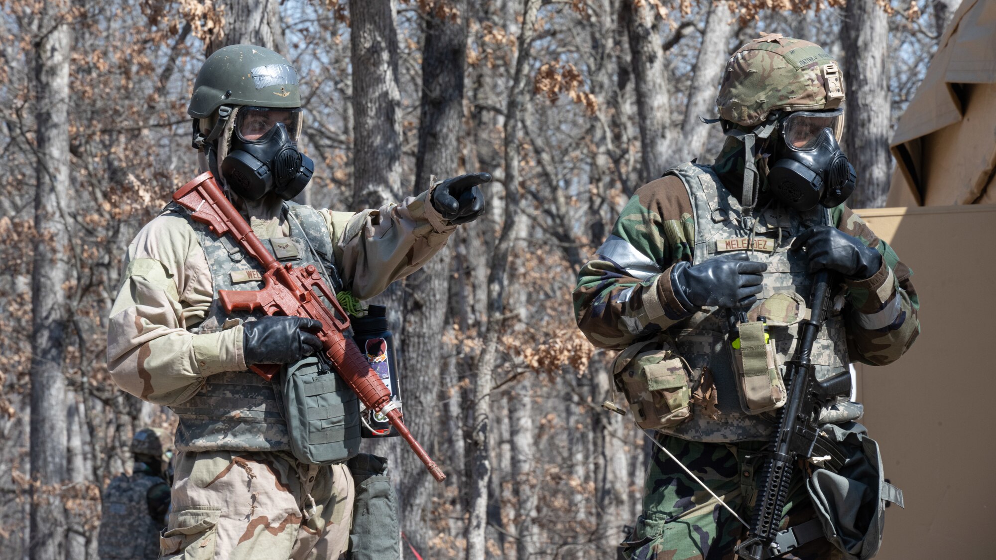 Airman 1st Class Ethan Welsh, 509th Civil Engineering squadron electrical systems journeymen, and Airman 1st Class Matthew Melendez, 509th Civil Engineering squadron structures technician, conduct a post-attack reconnaissance sweep during a field training exercise in Macon, Mo., March 13, 2025. The exercise tested warfighter readiness by simulating austere environments and complex enemy engagements, pushing participants to adapt and overcome challenges. (U.S. Air Force photo by Senior Airman Bryson Sherard)