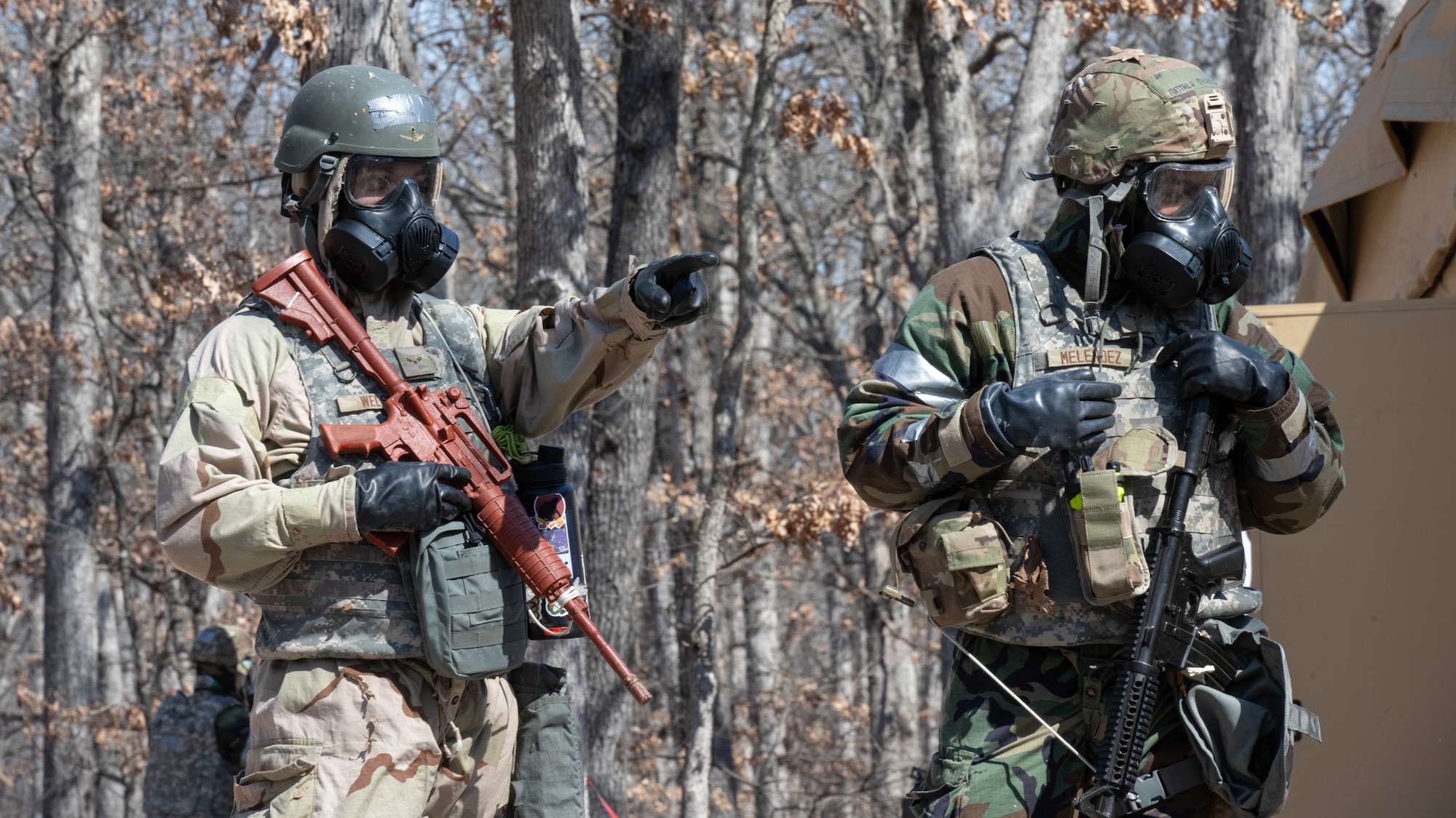 Airman 1st Class Ethan Welsh, 509th Civil Engineering squadron electrical systems journeymen, and Airman 1st Class Matthew Melendez, 509th Civil Engineering squadron structures technician, conduct a post-attack reconnaissance sweep during a field training exercise in Macon, Mo., March 13, 2025. The exercise tested warfighter readiness by simulating austere environments and complex enemy engagements, pushing participants to adapt and overcome challenges. (U.S. Air Force photo by Senior Airman Bryson Sherard)