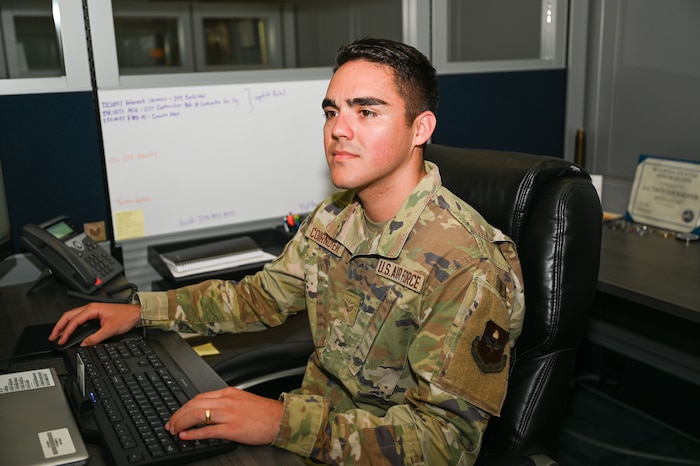U.S. Air Force Senior Airman Troy Cournoyer, 42nd Contracting Squadron contracting specialist, works on his computer at Maxwell Air Force Base, Alabama, March 24, 2025.