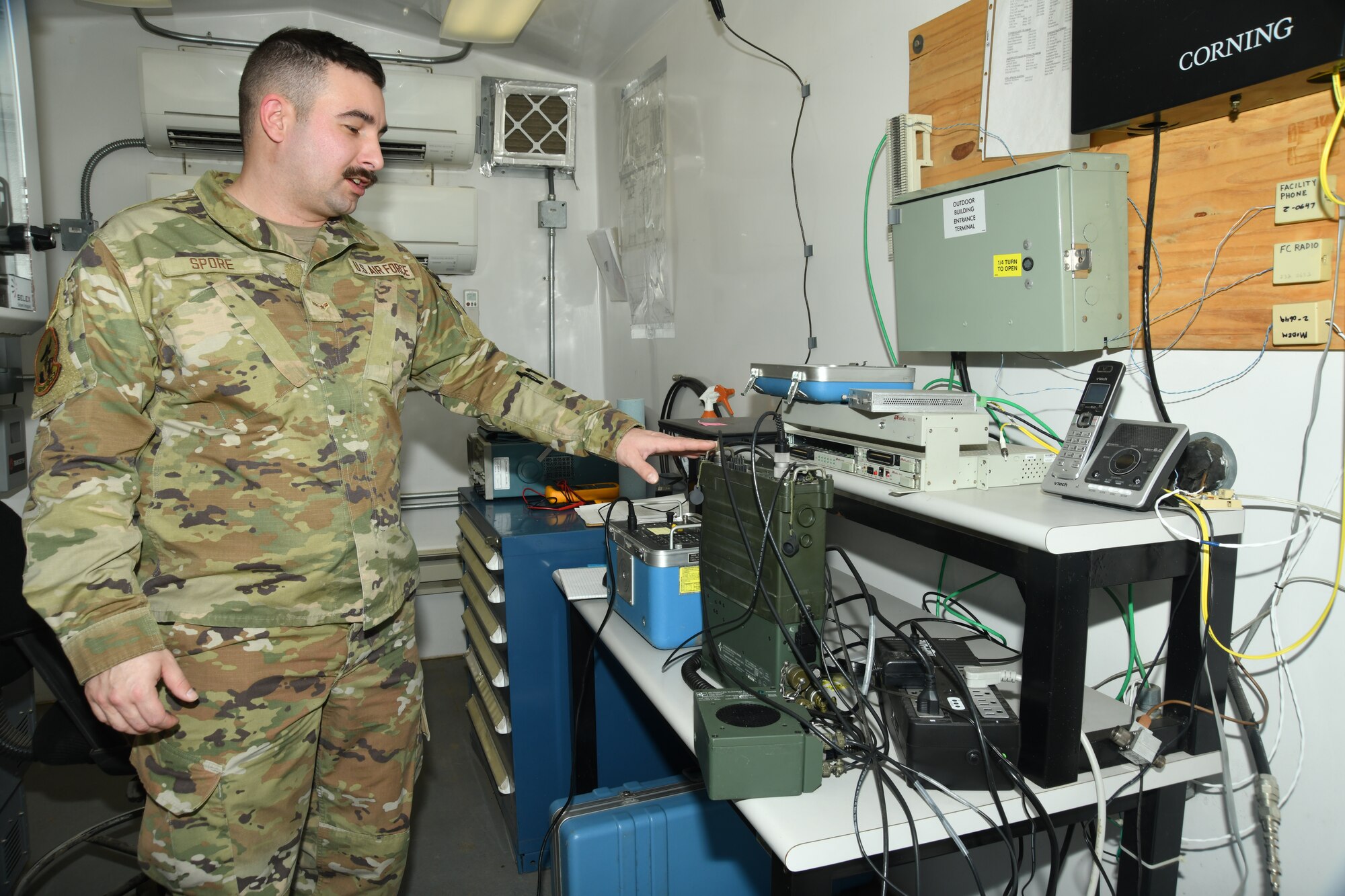 Airman facing laptop