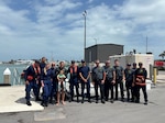 A Coast Guard Station Fort Pierce boat crew poses for a picture after a successful response to a kite surfer in distress. No medical concerns were reported. (U.S. Coast Guard photo)