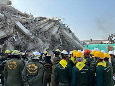 U.S. Military personnel from U.S. Indo-Pacific Command meet with first responders at the Search and Rescue Operations Center near the collapsed State Audit Office building in Bangkok, which fell after a 7.7 earthquake hit Thailand and its neighbor countries on March 28, 2025.