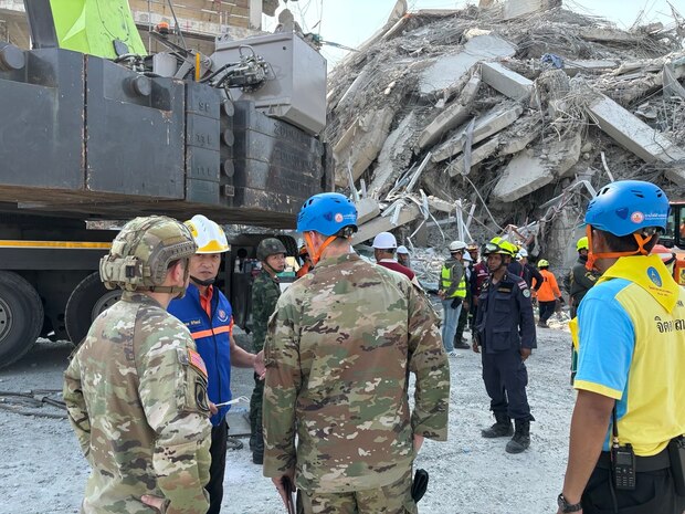 U.S. Military personnel from U.S. Indo-Pacific Command meet with first responders at the Search and Rescue Operations Center near the collapsed State Audit Office building in Bangkok, which fell after a 7.7 earthquake hit Thailand and its neighbor countries on March 28, 2025.
