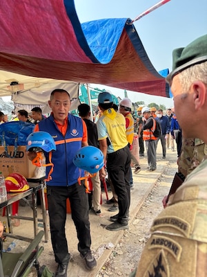 U.S. Military personnel from U.S. Indo-Pacific Command meet with first responders at the Search and Rescue Operations Center near the collapsed State Audit Office building in Bangkok, which fell after a 7.7 earthquake hit Thailand and its neighbor countries on March 28, 2025.