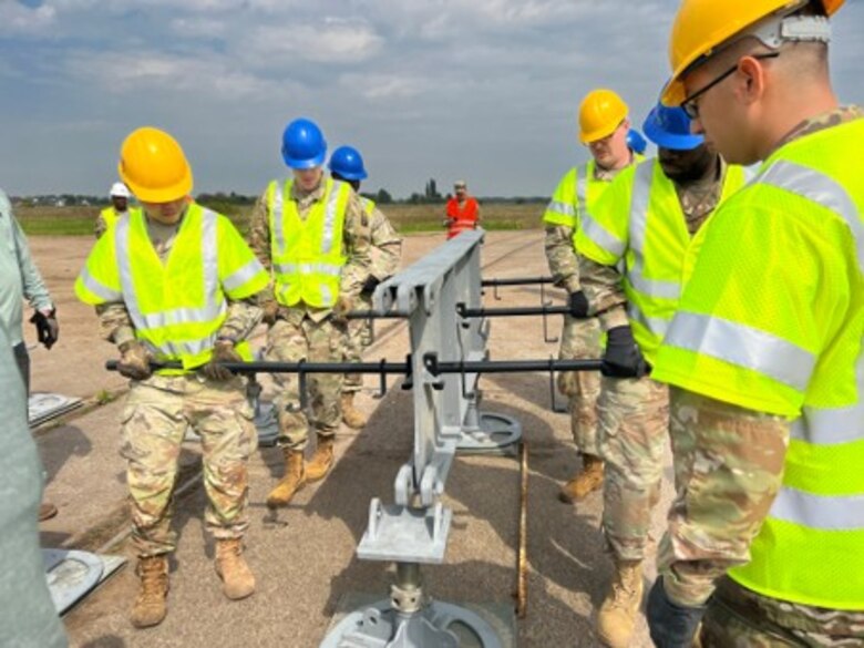 Army engineers assemble a Rapidly Available Interface for Trans-loading (RAIL) system at Coleman Barracks in Mannheim, Germany in May of 2022