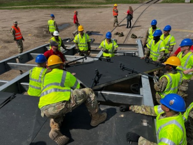 Army engineers assemble a Rapidly Available Interface for Trans-loading (RAIL) system at Coleman Barracks in Mannheim, Germany in May of 2022