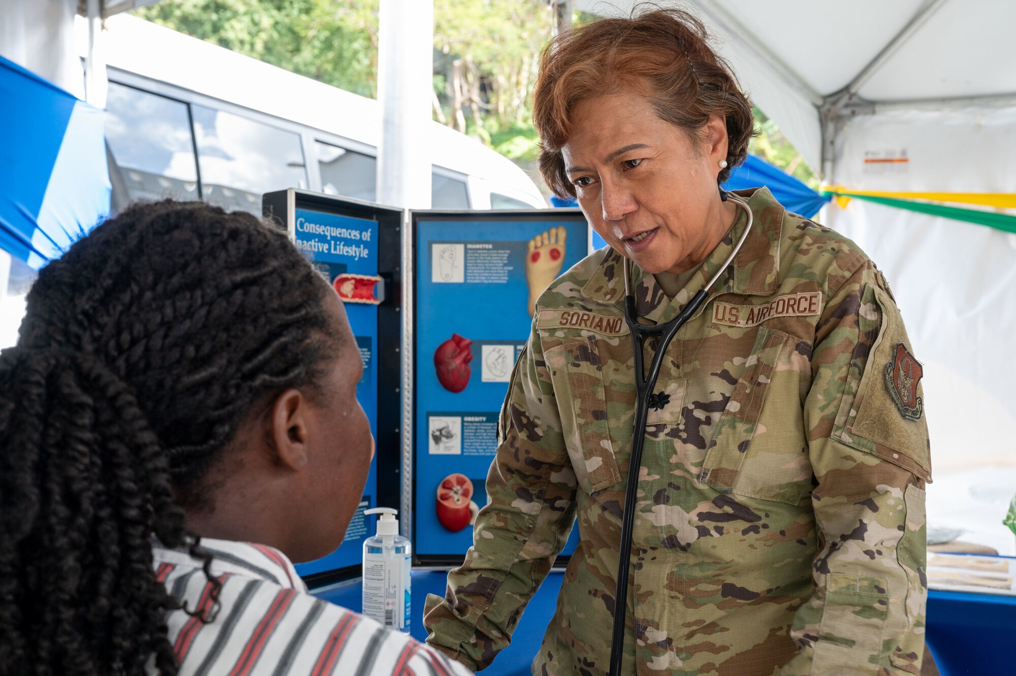 U.S. Air Force Lt. Col Zoraida Soriano, 349th Medical Squadron internal medicine doctor, conducts a health consultation with a local resident during the Lesser Antilles Medical Assistance Team (LAMAT) 2025 health fair at Kingstown, Saint Vincent and the Grenadines, March 20, 2025.