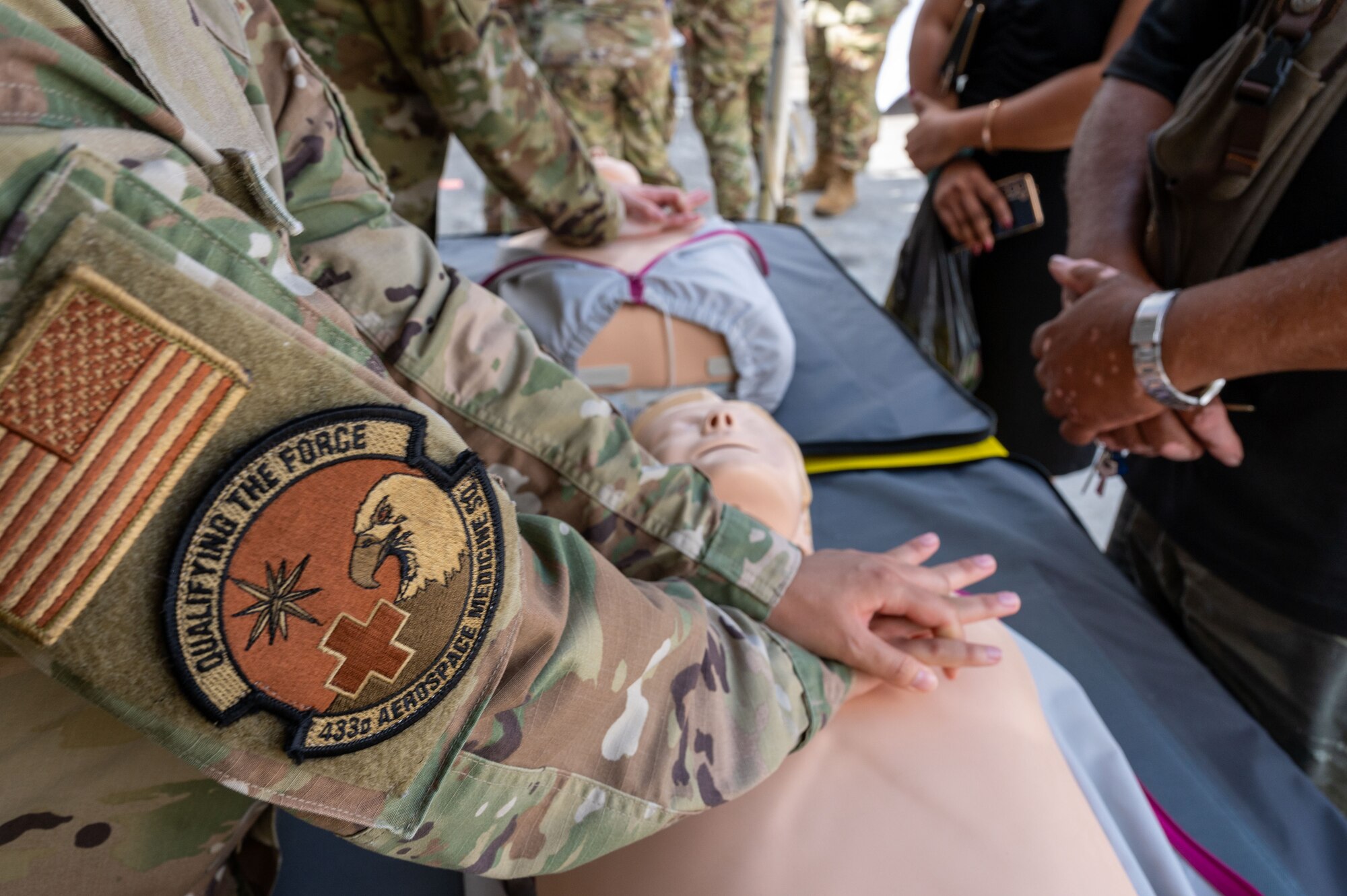 U.S. Air Force Staff Sgt. Monique Downs, 433rd Aerospace Medicine Squadron medical technician, demonstrates chest compressions on a CPR training mannequin during the Lesser Antilles Medical Assistance Team (LAMAT) 2025 health fair at Kingstown, Saint Vincent and the Grenadines, March 20, 2025.