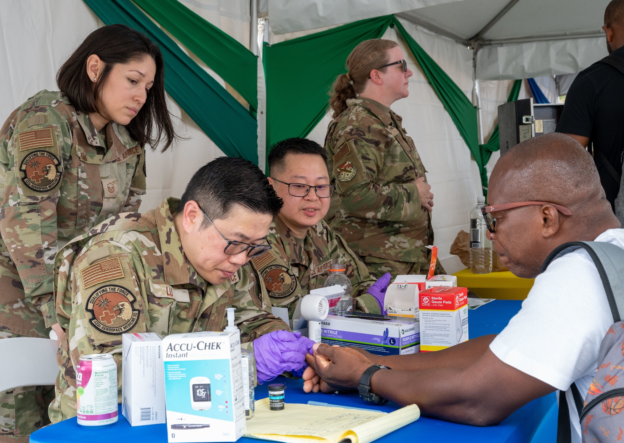 U.S. Air Force medical professionals from the 433rd Aerospace Medicine Squadron conduct blood sugar screenings during the Lesser Antilles Medical Assistance Team (LAMAT) 2025 health fair at Kingstown, Saint Vincent and the Grenadines, March 20, 2025.