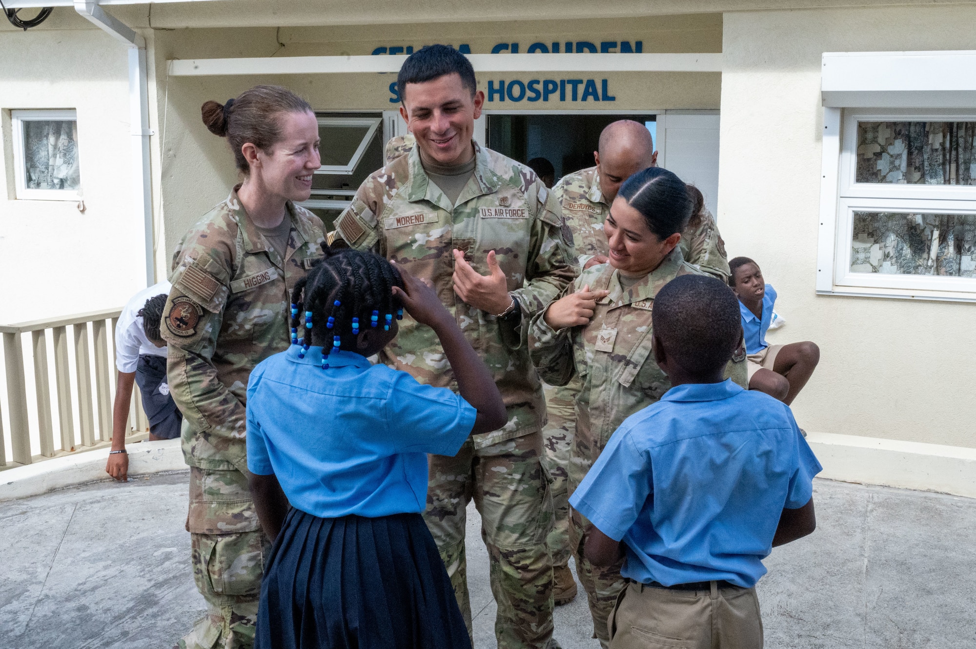 U.S. Air Force Reserve Citizen Airmen from the Lesser Antilles Medical Assistance Team (LAMAT) 2025 mission interact with local school children at Celina Clouden Smart Hospital, Union Island, Saint Vincent and the Grenadines, March 20, 2025.