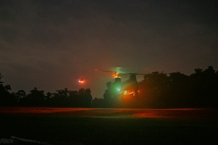 Singapore CH-47SD/F Chinook heavy-lift helicopters prepare to land at Military Training Area (West), Singapore, on March 25, 2025, in preparation for the Valiant Mark 25 field training exercise taking place at SAFTI City training facility.