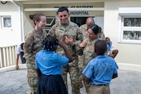 U.S. Air Force Reserve Citizen Airmen from the Lesser Antilles Medical Assistance Team (LAMAT) 2025 mission interact with local school children at Celina Clouden Smart Hospital, Union Island, Saint Vincent and the Grenadines, March 20, 2025.