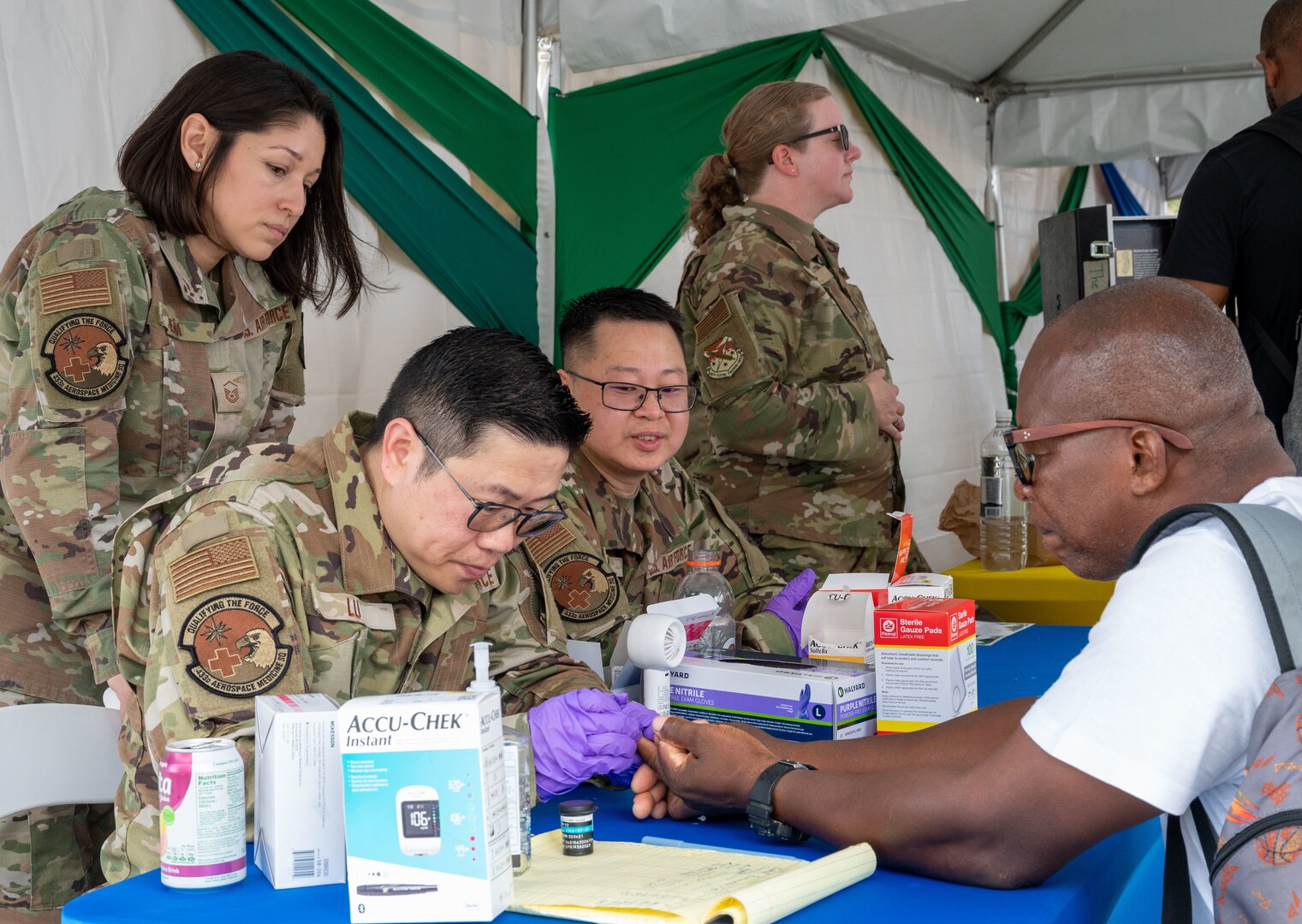 U.S. Air Force medical professionals from the 433rd Aerospace Medicine Squadron conduct blood sugar screenings during the Lesser Antilles Medical Assistance Team (LAMAT) 2025 health fair at Kingstown, Saint Vincent and the Grenadines, March 20, 2025.