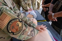 U.S. Air Force Staff Sgt. Monique Downs, 433rd Aerospace Medicine Squadron medical technician, demonstrates chest compressions on a CPR training mannequin during the Lesser Antilles Medical Assistance Team (LAMAT) 2025 health fair at Kingstown, Saint Vincent and the Grenadines, March 20, 2025.