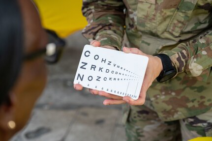 U.S. Air Force Maj. Monica Bentley, 433rd Aerospace Medicine Squadron optometrist, conducts a vision screening during the Lesser Antilles Medical Assistance Team (LAMAT) 2025 health fair at Kingstown, Saint Vincent and the Grenadines, March 20, 2025.