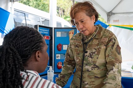 U.S. Air Force Lt. Col Zoraida Soriano, 349th Medical Squadron internal medicine doctor, conducts a health consultation with a local resident during the Lesser Antilles Medical Assistance Team (LAMAT) 2025 health fair at Kingstown, Saint Vincent and the Grenadines, March 20, 2025.