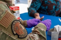 U.S. Air Force Master Sgt. Stephanie Peña, 433rd Aerospace Medicine Squadron medical laboratory technician, administers a blood sugar test during the Lesser Antilles Medical Assistance Team (LAMAT) 2025 health fair at Kingstown, Saint Vincent and the Grenadines, March 20, 2025.