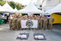 The U.S. Air Force St. Vincent Lesser Antilles Medical Assistance Team (LAMAT)  poses for a group photo before the start of a health fair at Kingstown, Saint Vincent and the Grenadines, March 20, 2025.