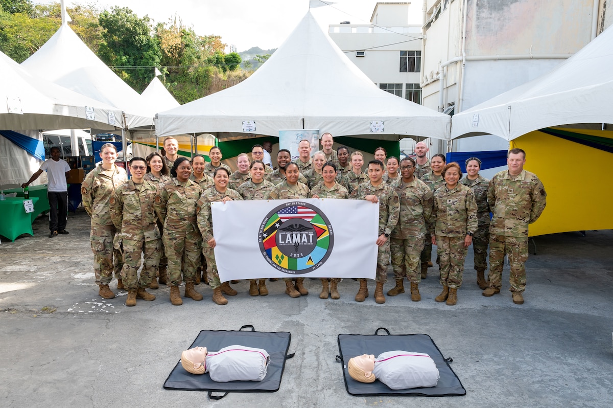 The U.S. Air Force St. Vincent Lesser Antilles Medical Assistance Team (LAMAT)  poses for a group photo before the start of a health fair at Kingstown, Saint Vincent and the Grenadines, March 20, 2025.