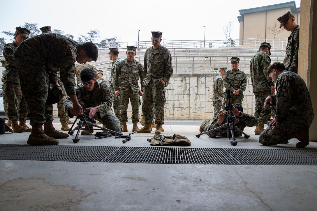 U.S. Marines with Marine Wing Support Squadron (MWSS) 171, Marine Aircraft Group 12, 1st Marine Air Wing, take part in disassembly training for the M249B light machine gun at Camp Mujuk, South Korea, March 27, 2025. Marines and Sailors with MWSS-171 deployed to South Korea to improve readiness in aviation ground support operations for Marine, joint, and allied forces on the Korean peninsula. (U.S. Marine Corps photo by Cpl. Brian Long)