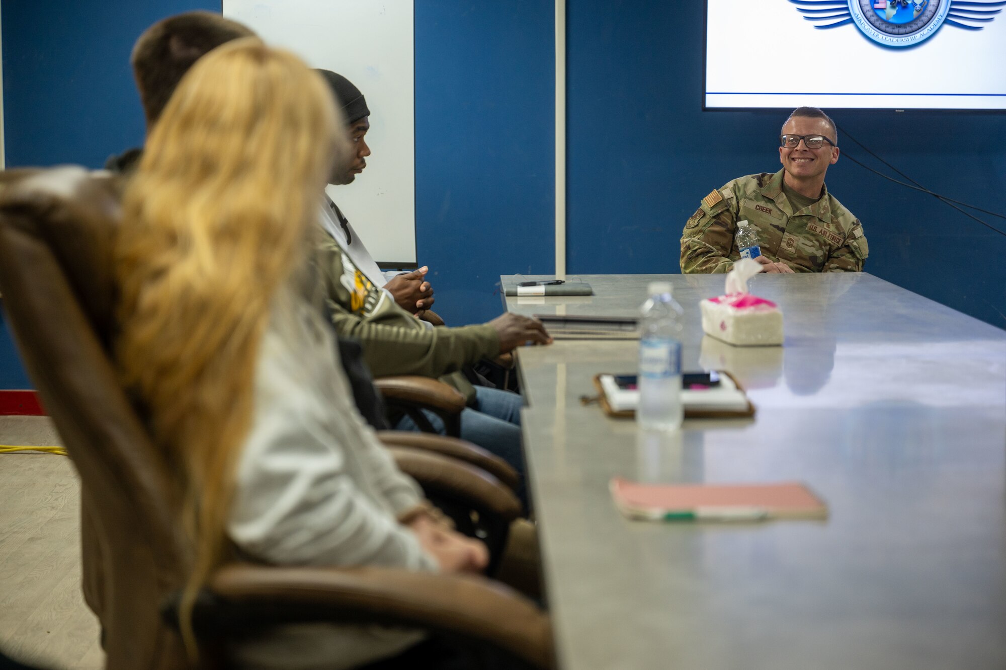 U.S. Air Force Chief Master Sgt. Steven Creek, 378th Air Expeditionary Wing command chief, speaks with a student during an Airpower Leadership Academy class in the U.S. Central Command area of responsibility, Jan. 8, 2025.