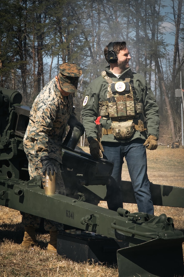 Vice President JD Vance, right, participates in firing the M101A1 105 mm howitzer alongside U.S. Marine Corps Sgt. Dillan B. Braud, a field artillery cannoneer with Combat Instructor Battalion, The Basic School, during a live-fire range at Weapons Training Battalion on Marine Corps Base Quantico, Virginia, March 26, 2025. Vance served in the Marine Corps as a combat correspondent, including a deployment to Iraq in support of Operation Iraqi Freedom. The purpose of his visit was to engage with Marines, reconnect with the Corps, and experience firsthand the training that shapes the next generation of Marines. (U.S. Marine Corps photo by Cpl. Joshua Barker)