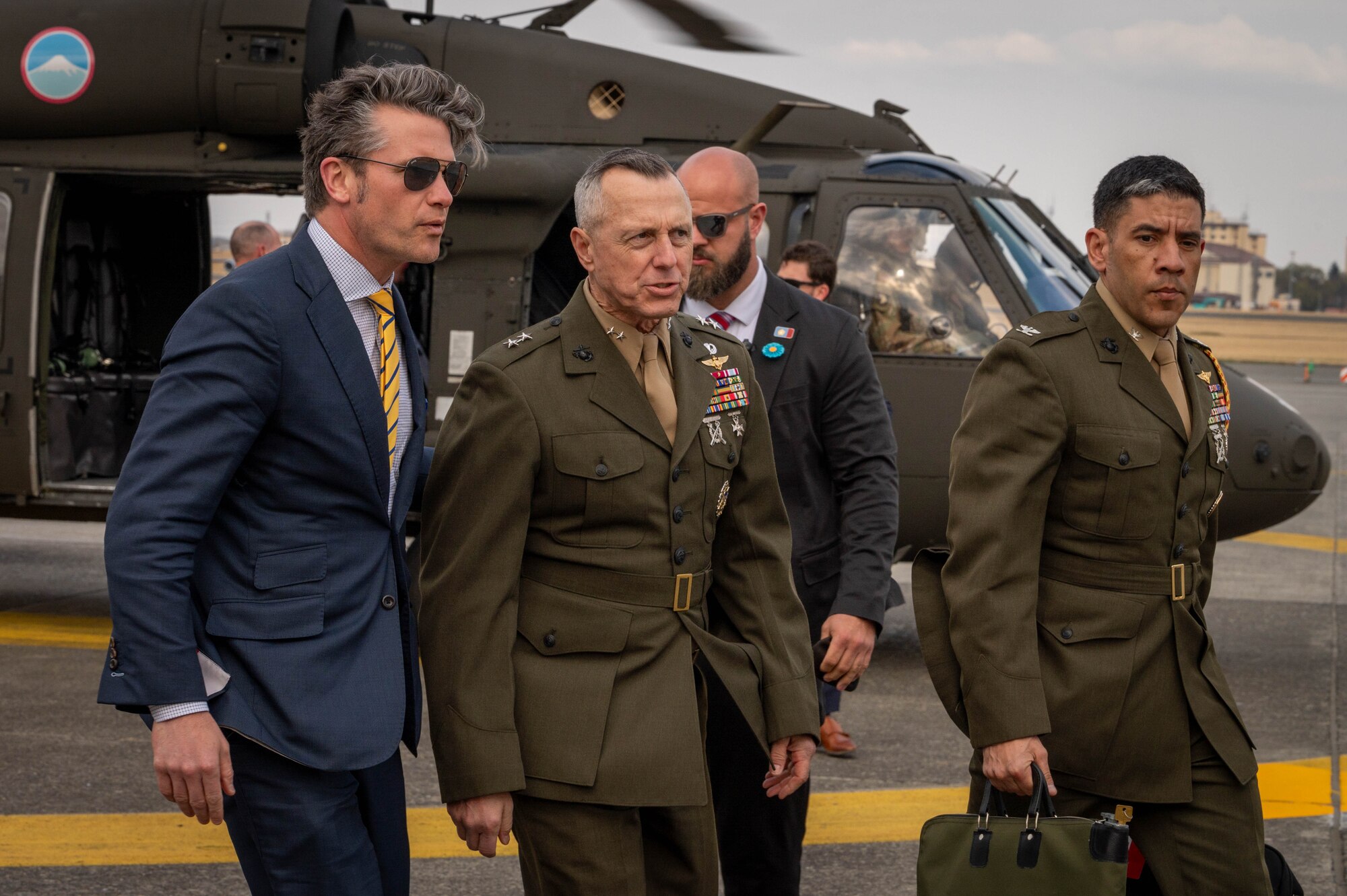 SECDEF exits helicopter.