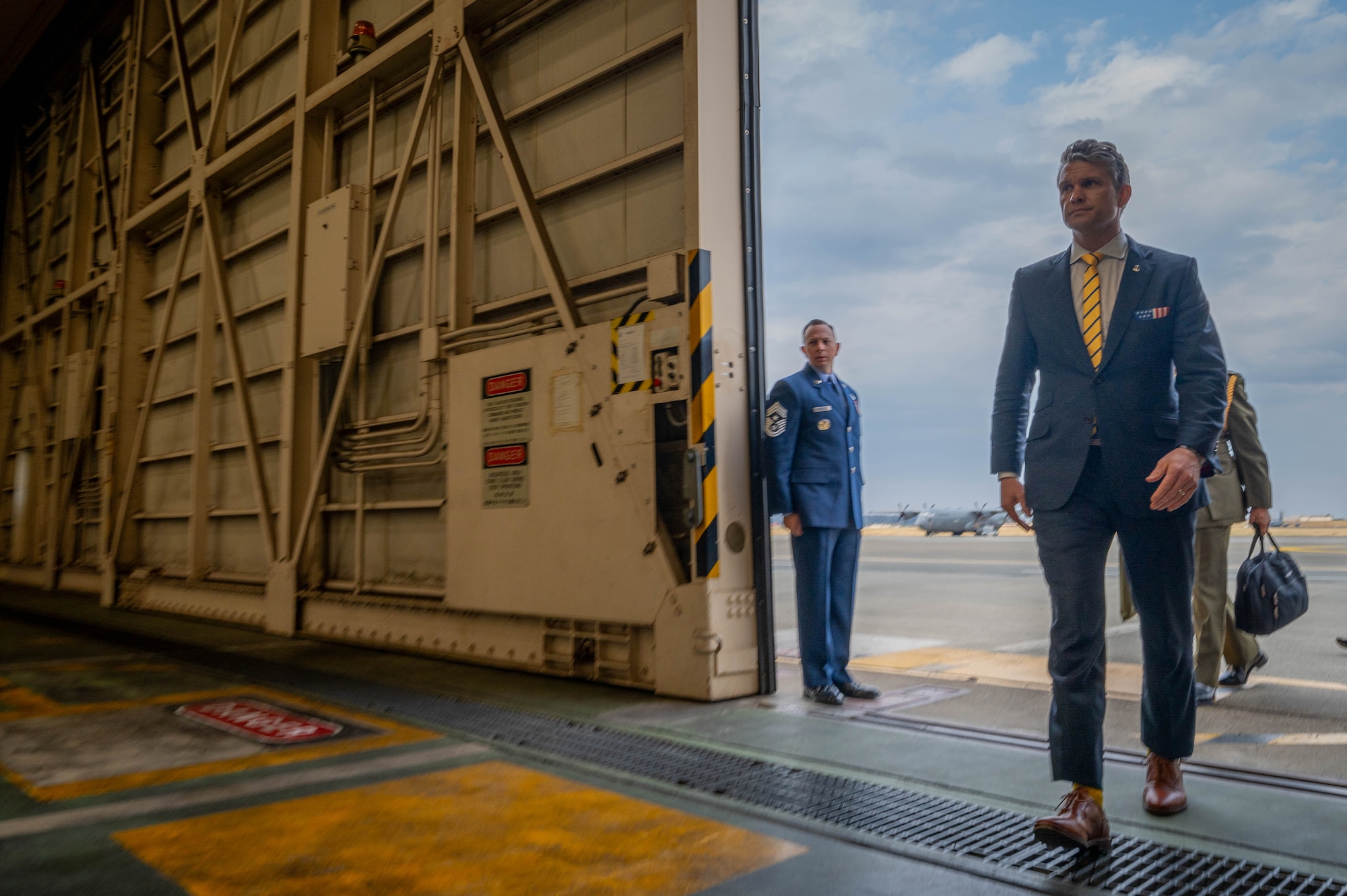 SECDEF enters hangar.