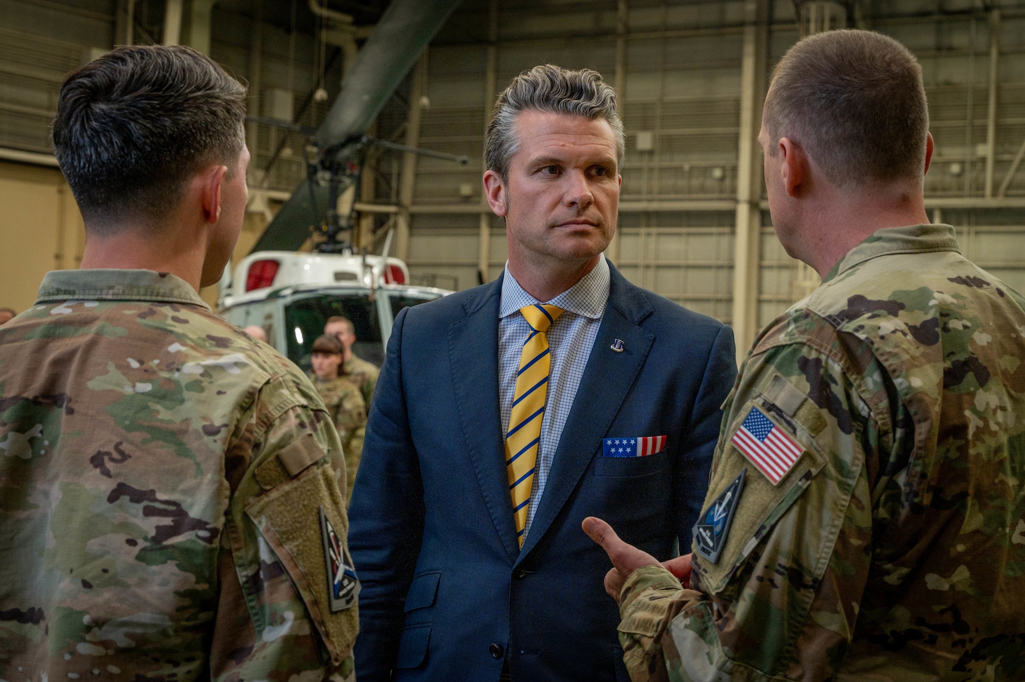 SECDEFS listens to U.S. Space Force Guardian introduce a fellow Guardian before presenting them with an appreciation coin.