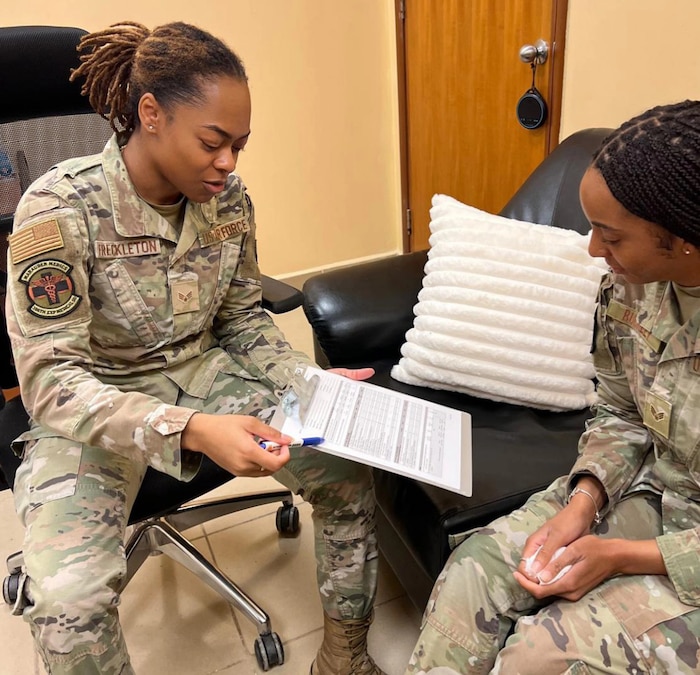 Image of Airmen talking to each other
