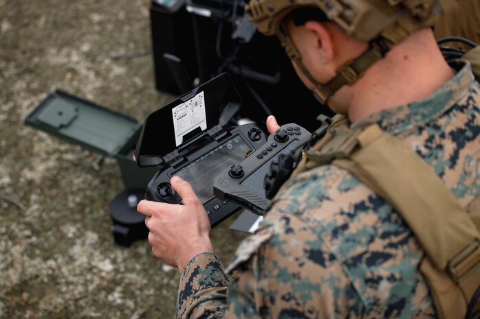 U.S. Marine Corps Cpl. Timothy J. Brockup Jr., a rifleman, marksmanship coach, and first-person-view attack drone operator with Weapons Training Battalion flies a Skydio X2D drone during a demonstration range at WTBn on Marine Corps Base Quantico, Virginia, March 7, 2025. The Marine Corps Attack Drone Team utilized the Skydio X2D drone as a reconnaissance drone on the range to showcase the drone’s capabilities on the battlefield. (U.S. Marine Corps photo by Cpl. Joshua Barker)