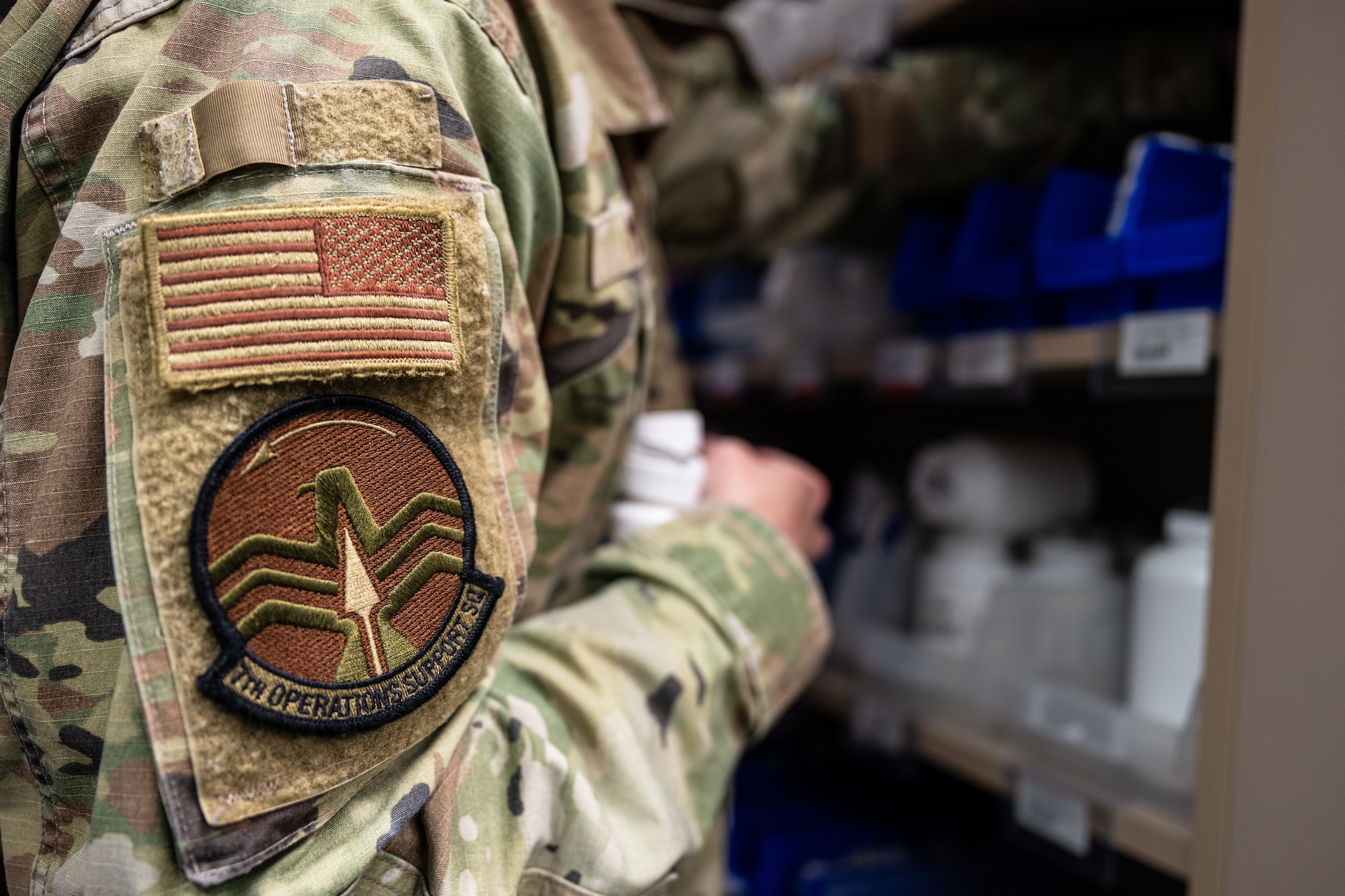 Tech. Sgt. Carl Miller, 7th Operations Support Squadron intelligence training flight chief, assists the 7th Medical Group with pharmacy operations at Dyess Air Force Base, Texas, March 26, 2025. This collaboration between the 7th Operations Group and 7th MDG enhances the wing's operational flexibility by training Airmen to fill roles outside of their primary duty when demand is high. (U.S. Air Force photo by Airman 1st Class Jade M. Caldwell)