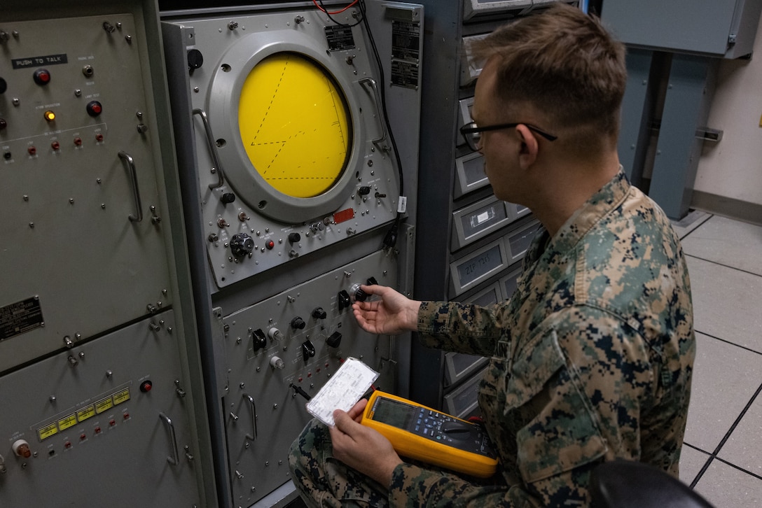 U.S. Marine Corps Lance Cpl. Alex Soja, air traffic control radar technician, Headquarters and Headquarters Squadron, Marine Corps Air Station (MCAS) Yuma, Arizona, demonstrates a daily routine check at MCAS Yuma, Arizona, March 7, 2025. Routine checks are performed on this system to ensure the Precision Approach Radar (PAR) is fully operationally before the tower assumes control of the MCAS Yuma airfield. (U.S. Marine Corps photo by Cpl. Jade K. Venegas)