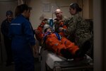 U.S. Navy and NASA medical personnel simulate a medical examination of an Astronaut aboard amphibious transport dock USS Somerset (LPD 25) during NASA Underway Recovery Test 12 medical drills in the Pacific Ocean, March 27, 2025.