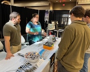 Ann Thomas, a biomedical equipment technician with the U.S. Army Medical Materiel Agency, demonstrates how to use a medical device to a group of students during the “Explore to Know More” event March 19 at Tobyhanna Army Depot, Pennsylvania. Also pictured is fellow technician Mike Tagliaferri. The first-ever event drew about 90 students from nearby high schools and colleges to learn about the depot’s mission and various technical and academic career fields available.