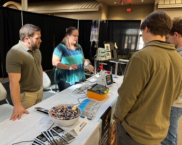 Ann Thomas, a biomedical equipment technician with the U.S. Army Medical Materiel Agency, demonstrates how to use a medical device to a group of students during the “Explore to Know More” event March 19 at Tobyhanna Army Depot, Pennsylvania. Also pictured is fellow technician Mike Tagliaferri. The first-ever event drew about 90 students from nearby high schools and colleges to learn about the depot’s mission and various technical and academic career fields available.