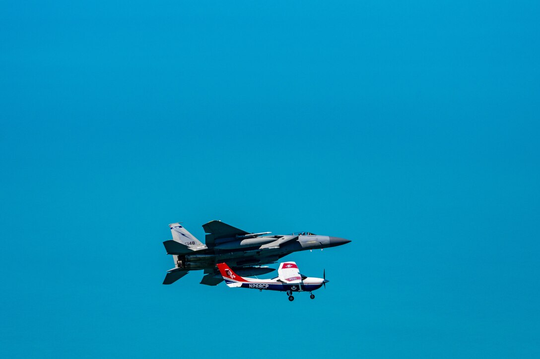An F-15 fighter jet from the Florida Air National Guard’s 125th Fighter Wing, Detachment 1, intercepted a simulated Temporary Flight Restriction violator during a demonstration near Homestead Air Reserve Base, Florida, March 26, 2025. The exercise, coordinated with a Civil Air Patrol Cessna, highlighted the importance of TFR compliance and the teamwork and precision of NORAD pilots tasked with protecting North American airspace.