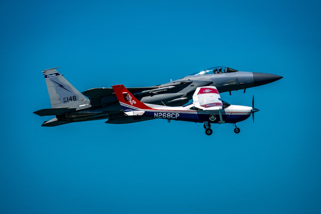 An F-15 fighter jet from the Florida Air National Guard’s 125th Fighter Wing, Detachment 1, intercepted a simulated Temporary Flight Restriction violator during a demonstration near Homestead Air Reserve Base, Florida, March 26, 2025. The exercise, coordinated with a Civil Air Patrol Cessna, highlighted the importance of TFR compliance and the teamwork and precision of NORAD pilots tasked with protecting North American airspace.