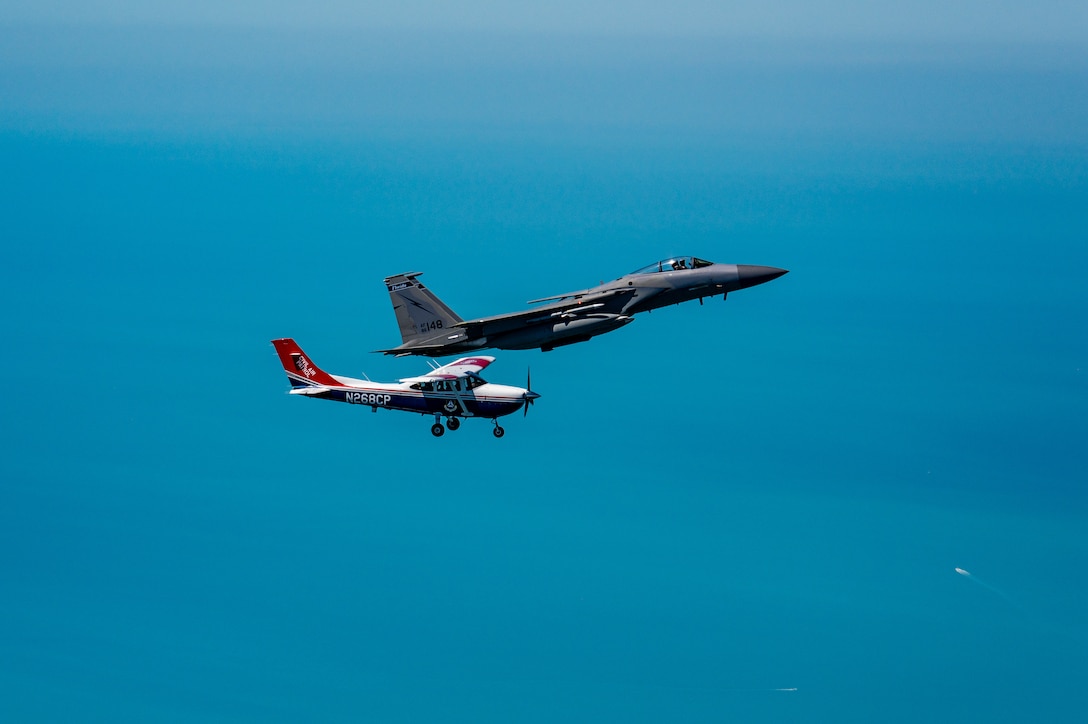 An F-15 fighter jet from the Florida Air National Guard’s 125th Fighter Wing, Detachment 1, intercepted a simulated Temporary Flight Restriction violator during a demonstration near Homestead Air Reserve Base, Florida, March 26, 2025. The exercise, coordinated with a Civil Air Patrol Cessna, highlighted the importance of TFR compliance and the teamwork and precision of NORAD pilots tasked with protecting North American airspace.