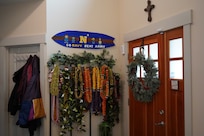 A “Go Navy Beat Army” sign in the entryway of the Maxwell family home, March 22, 2025. Maxwell was accepted to the U.S. Naval Academy and will become a midshipman in June joining the class of 2029. (U.S. Navy photo taken by Lt. Zachary Anderson)