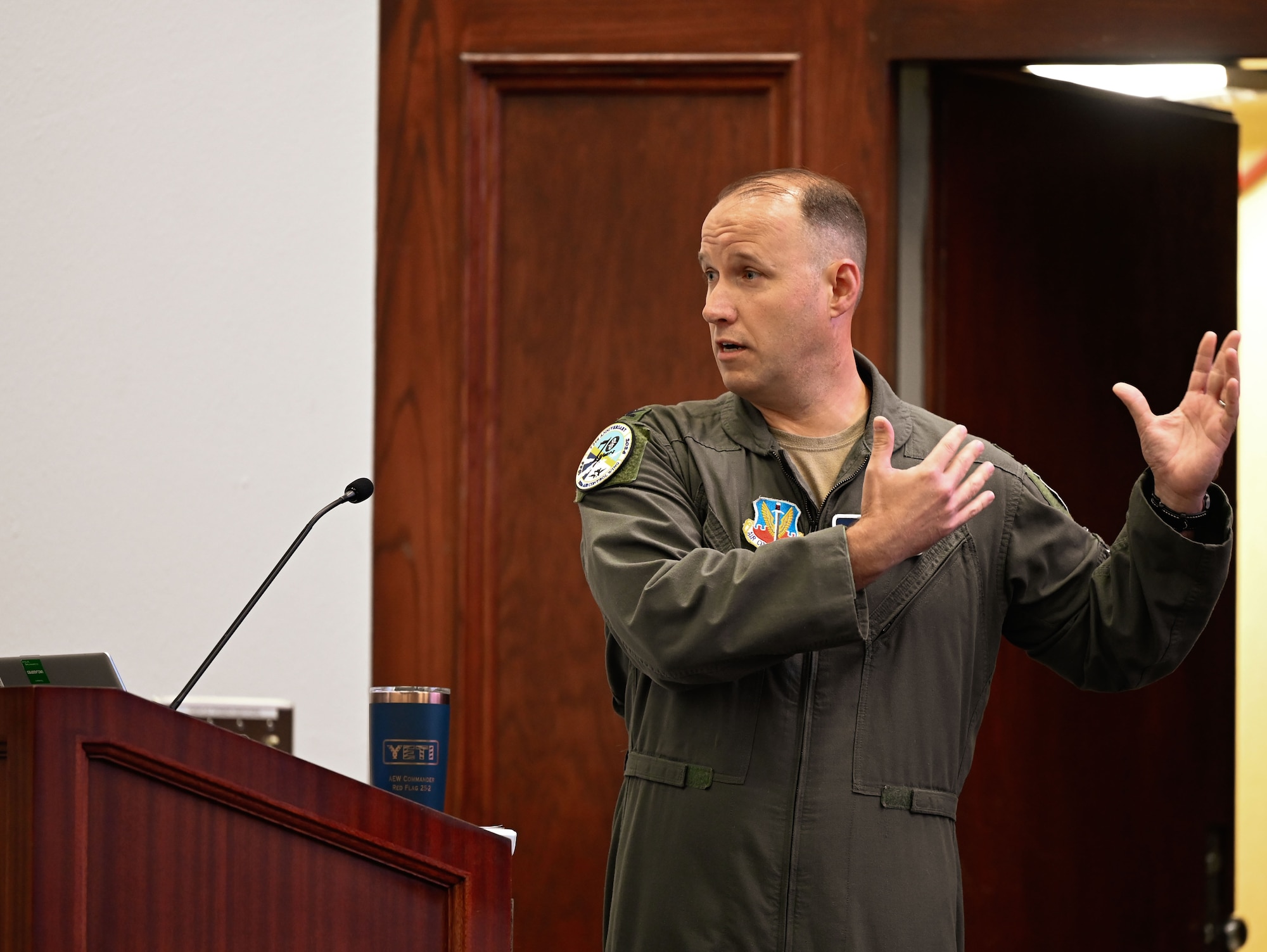 Col. Kenneth Voigt, 552nd Air Control Wing commander, shares insight on current operations during the 70th Anniversary Mission Brief at Tinker Air Force Base, Oklahoma, March 27, 2025.
The briefing offered attendees a chance to engage with leadership and reflect on seven decades of air power.
(U.S. Air Force photo by Garrett N. Cole)