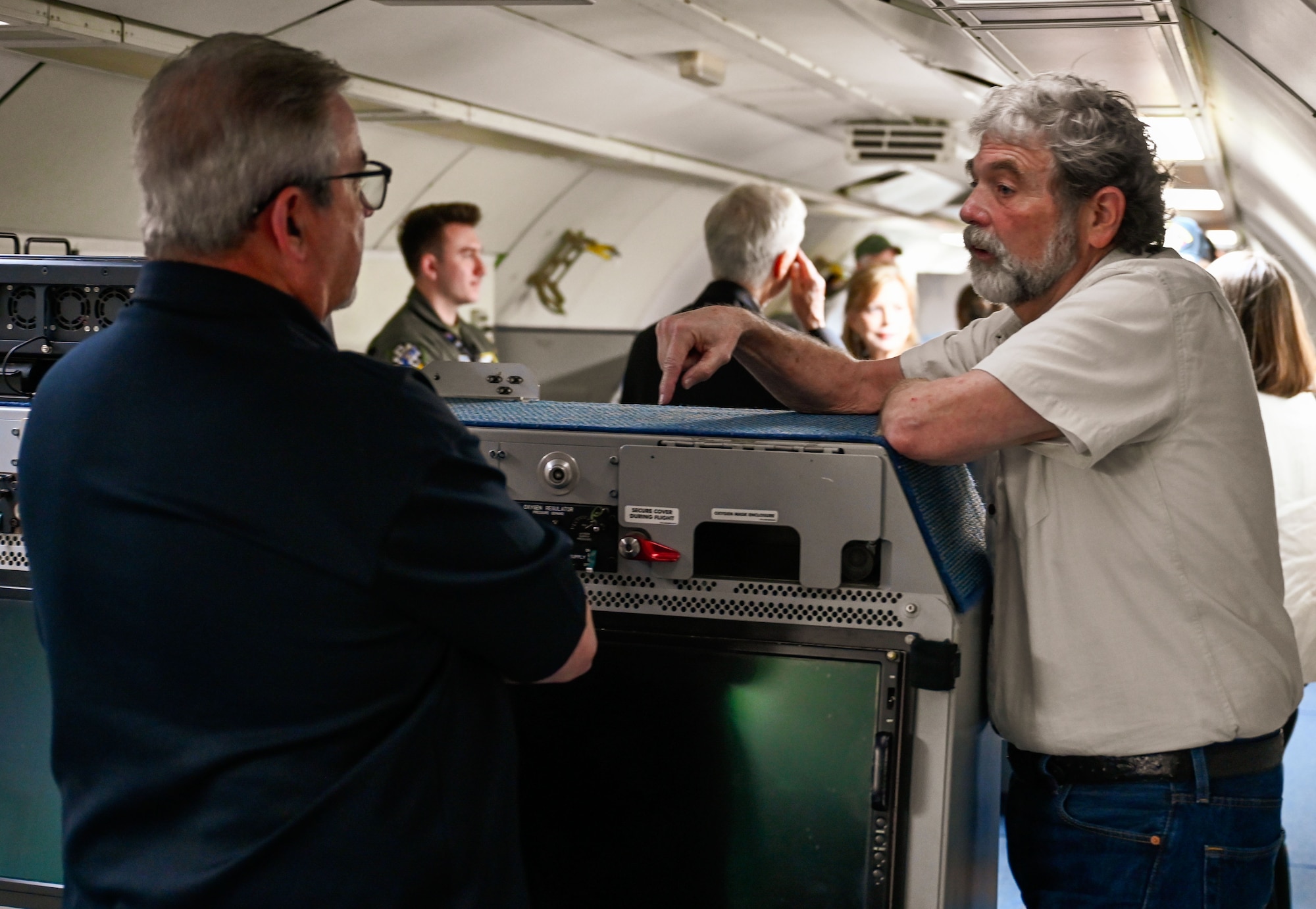 A 552nd Air Control Wing Airman explains the E-3 Sentry’s onboard systems to visitors during the 70th Anniversary Burger Burn at Tinker Air Force Base, Oklahoma, March 27, 2025. Guests explored the aircraft’s mission systems and spoke with operators.
(U.S. Air Force photo by Garrett N. Cole)