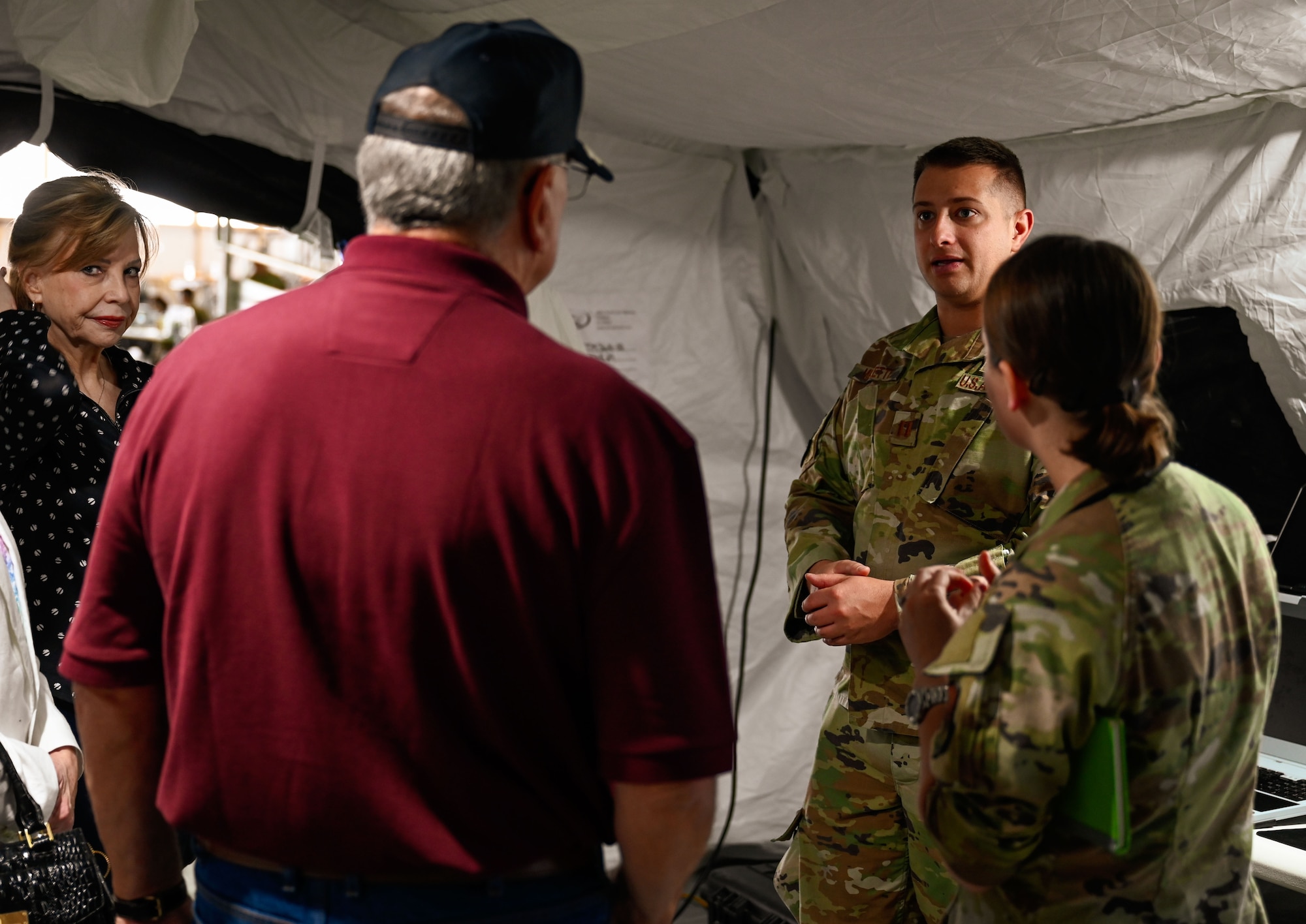 Guests interact with 552nd Air Control Wing Airmen inside a mobile command post during the wing’s 70th Anniversary Burger Burn at Tinker Air Force Base, Oklahoma, March 27, 2025. The exhibit showcased modern equipment and highlighted the Airmen supporting command and control missions.
(U.S. Air Force photo by Garrett N. Cole)