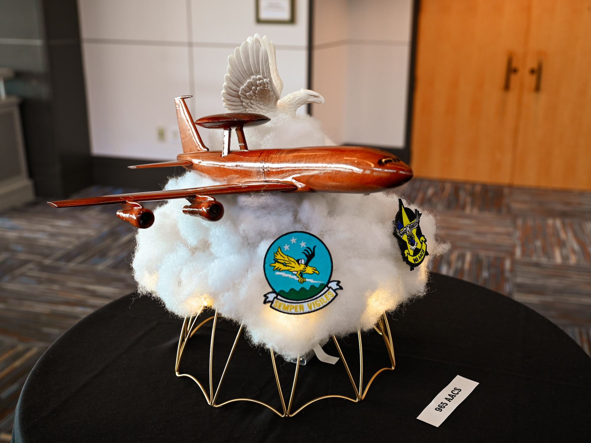 A handcrafted table centerpiece from the 965th Airborne Air Control Squadron is displayed during the 552nd Air Control Wing’s 70th Anniversary Banquet at Tinker Air Force Base, Oklahoma, March 27, 2025. Each squadron designed a unique display to showcase unit heritage and esprit de corps.
(U.S. Air Force photo by Garrett N. Cole)