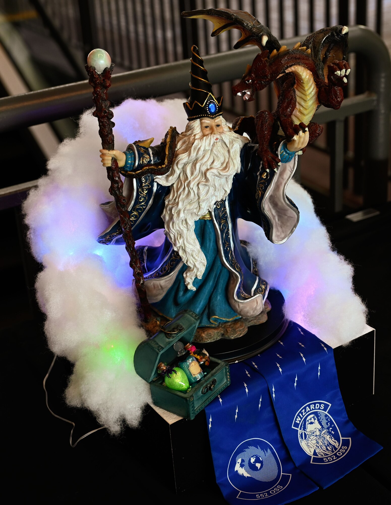 A fantasy-themed display by the 552nd Operations Support Squadron adds creative flair to the 552nd Air Control Wing’s 70th Anniversary Banquet at Tinker Air Force Base, Oklahoma, March 27, 2025. The figurine stands atop a bed of illuminated clouds and represents the "Wizards" heritage.
(U.S. Air Force photo by Garrett N. Cole)