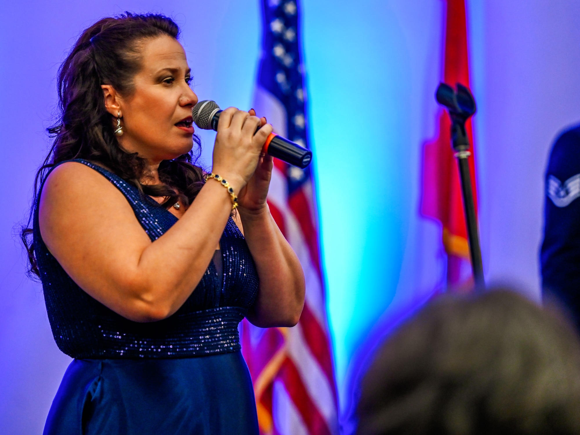 A vocalist performs the national anthem during the 552nd Air Control Wing’s 70th Anniversary Banquet at Tinker Air Force Base, Oklahoma, March 27, 2025. The evening honored decades of Airborne Warning and Control System excellence.
(U.S. Air Force photo by Garrett N. Cole)