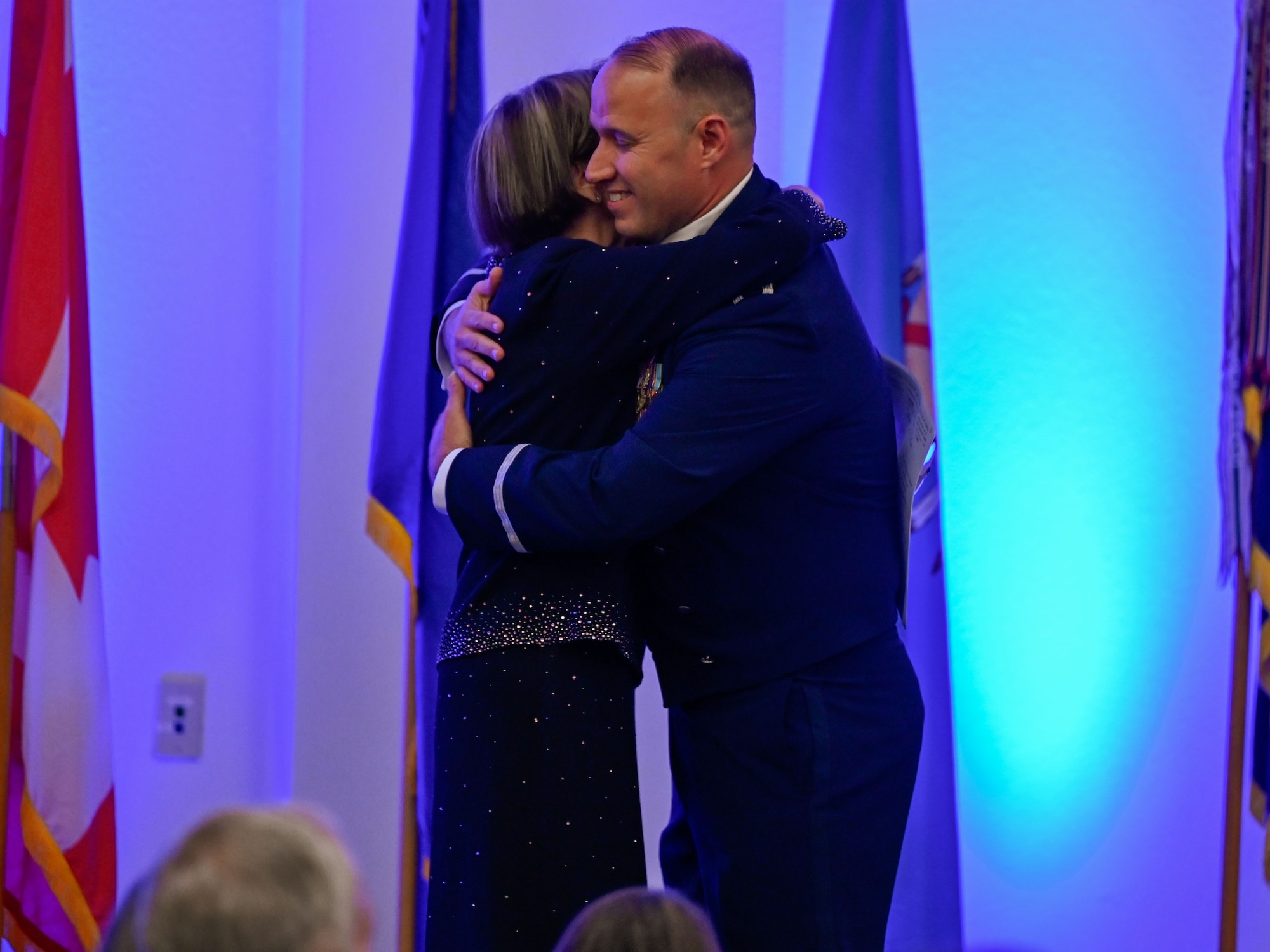Col. Kenneth Voigt, 552nd Air Control Wing commander, embraces retired Gen. Lori J. Robinson during the 552nd Air Control Wing's 70th Anniversary Banquet. The evening highlighted mentorship, legacy and enduring partnerships.
(U.S. Air Force photo by Garrett N. Cole)