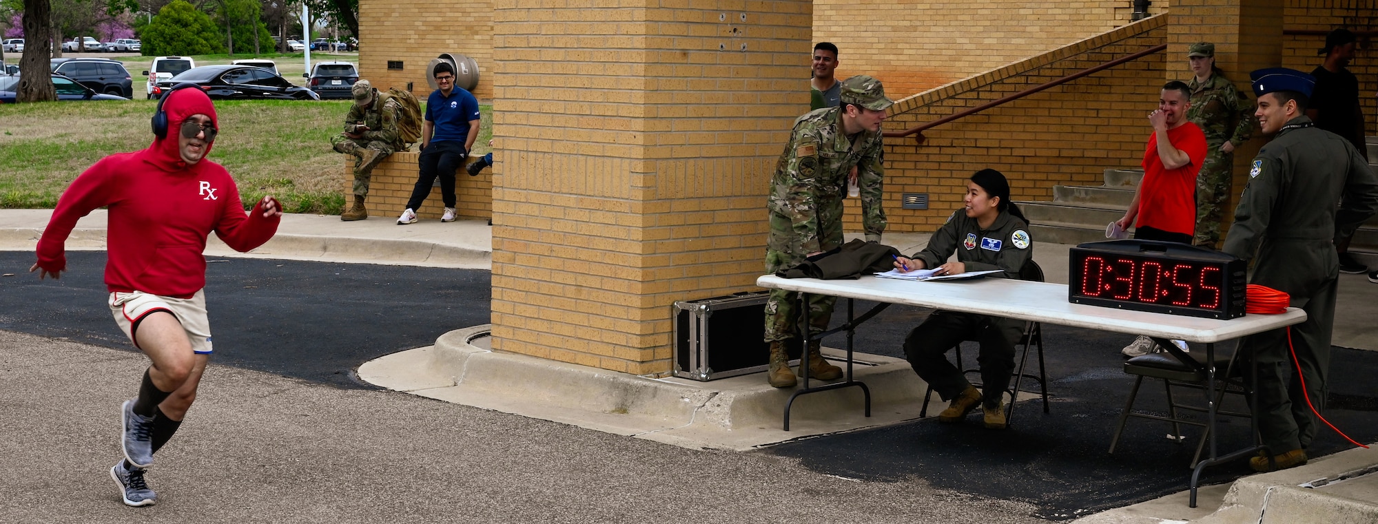 A runner crosses the finish line during the 552nd Air Control Wing’s 5K run at the Tinker Event Center, March 28, part of the wing’s 70th Anniversary celebration. The event promoted fitness and camaraderie among participants.
(U.S. Air Force photo by Garrett N. Cole)