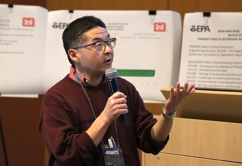Kinya “Roger” Minami, a procurement analyst with the Los Angeles District’s Small Business Office, reads project details from an overhead projector during the Iron King Mine Project Industry Day Jan. 28 at Gateway Community College in Phoenix. The event, led by the Los Angeles District’s Claudia Garcia, project manager, and Minami, invited vendors to discuss environmental remediation projects in Dewey-Humboldt, Arizona, located an hour north of Phoenix. (Photo by Robert DeDeaux, Los Angeles District PAO)